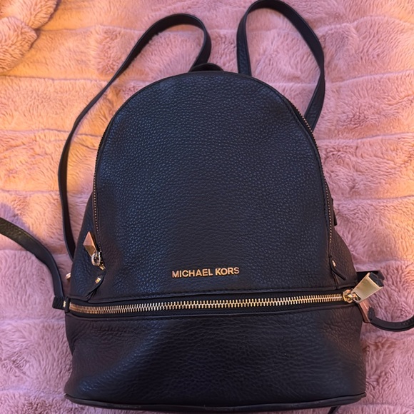 Rhea micheal Kors pebbled leather backpack